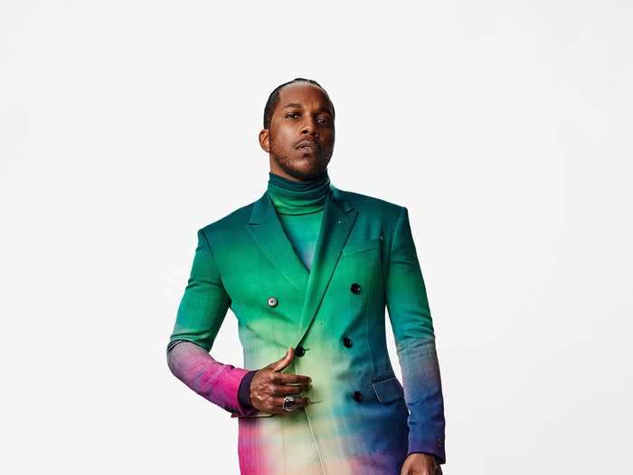 Leslie Odom Jr. opted for a multi-colored suit and turtleneck at the SAG Awards.