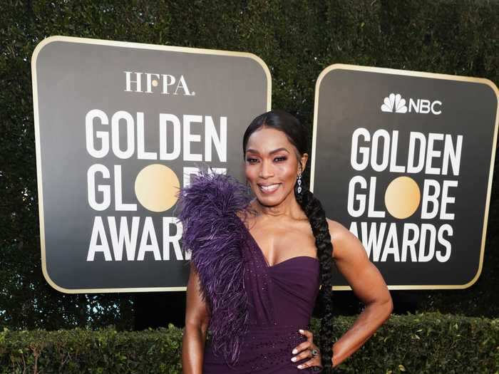 Angela Bassett looked regal as ever in this feathered plum gown at the Golden Globes.