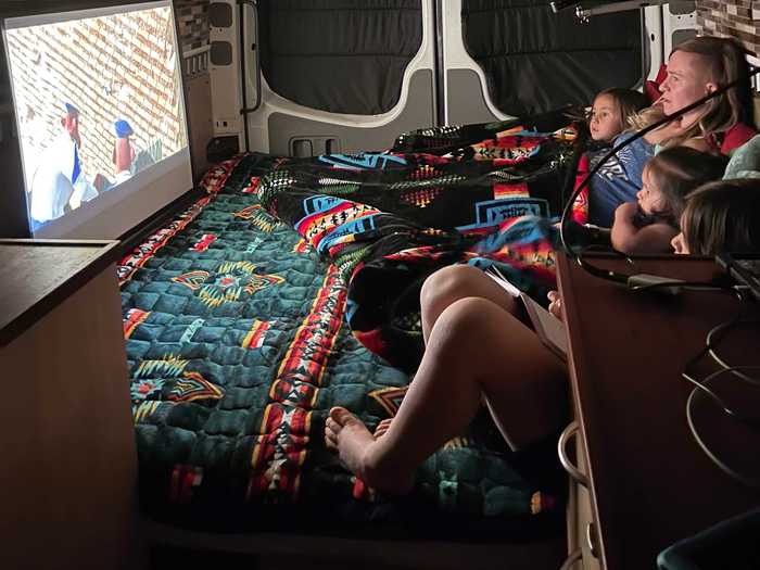 Every night is a movie night after dinnertime thanks to a projector in the van