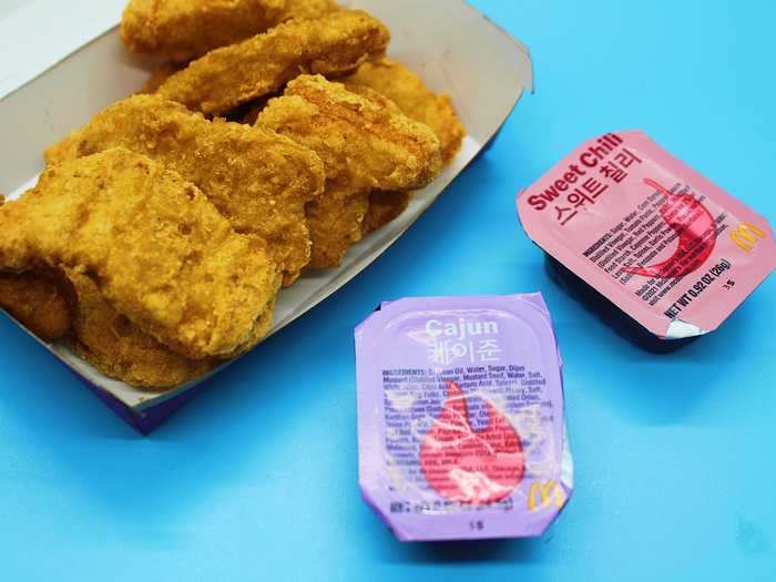 The meal comes with a Cajun sauce and sweet chili sauce for the nuggets and fries.