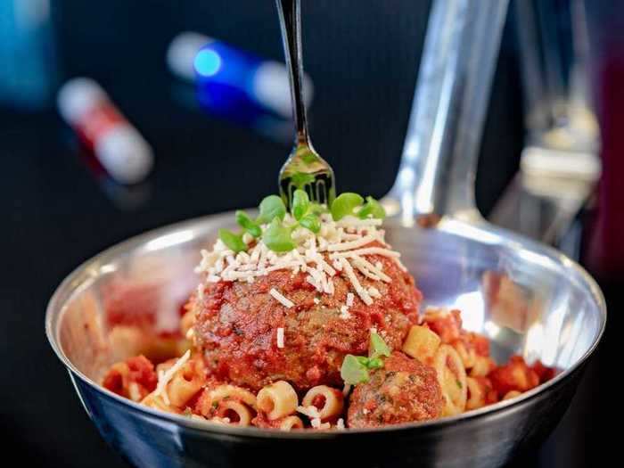The Impossible Spoonful comes with large and small pasta and a small and large plant-based meatball and cheese.