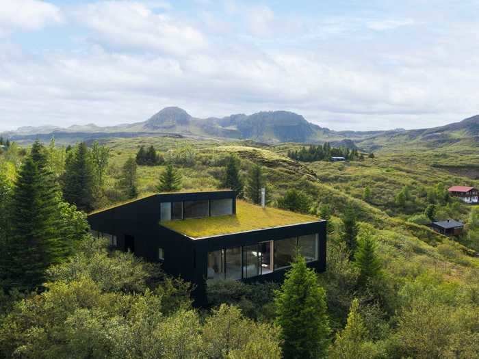 This three-bedroom home in Iceland was designed to blend in perfectly with the surrounding landscape.