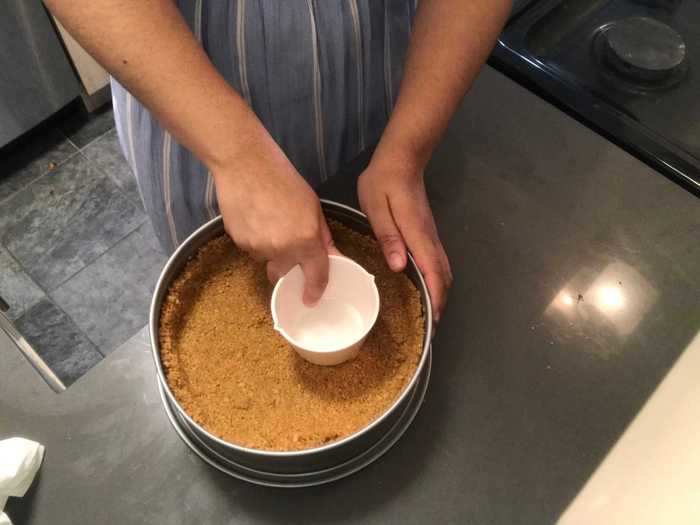 A measuring cup was perfect for pressing the graham-cracker crumbs into the springform pan.