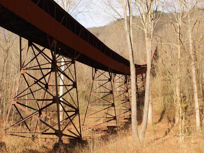 Visitors can walk trails that take them through vestiges of the coal and mining industry - such as remnants of Nuttallburg, an abandoned mining town where coal tipples run through the trees.