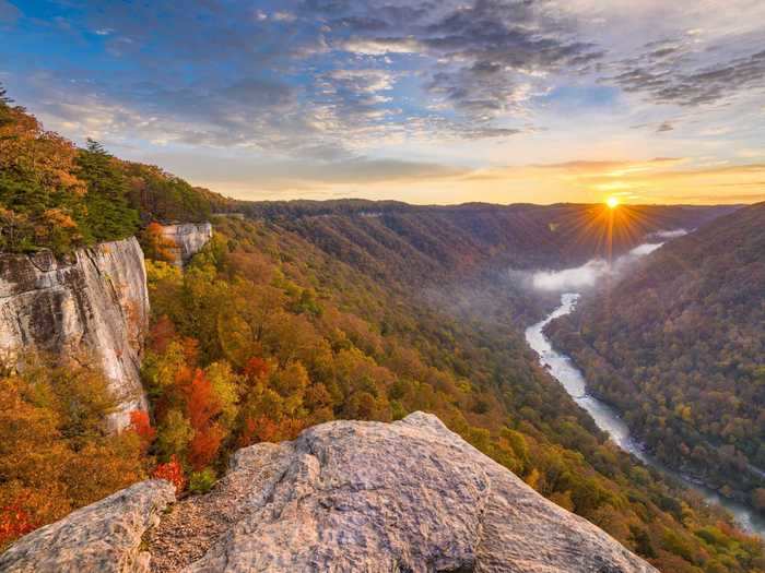 Climbers also flock to New River Gorge, which has more than 1,400 climbing routes. One of the most popular climbing areas is Endless Wall, a vertical sandstone cliff that rises 120 feet.