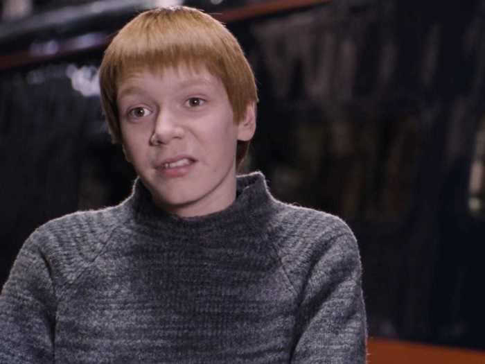 Fred Weasley is first seen wearing an identical outfit with his twin brother, George.