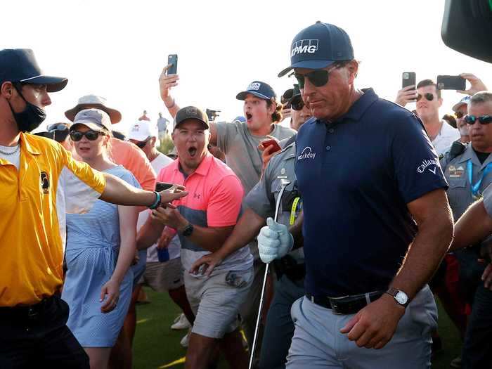 When Mickelson was set to finish his win on the 18th hole, fans followed him into the fairway and surrounded the green for his championship putts.