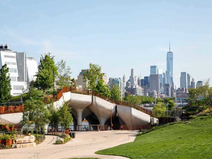 From the outside looking in, the park looks like bundles of green foliage and bronze fences atop the concrete, tulip-shaped pillars.