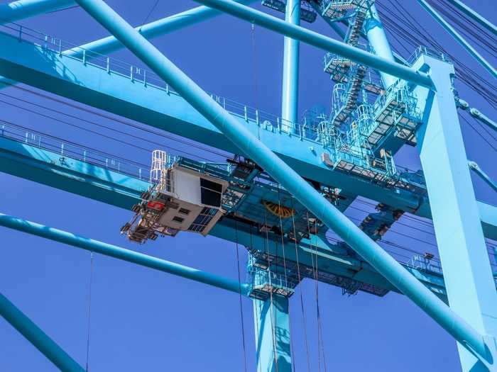 The longshoreman has an overhead view to make collecting the containers easier.