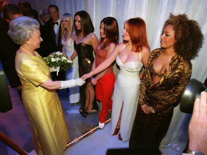 The Spice Girls wore their signature looks again to shake hands with Queen Elizabeth II.