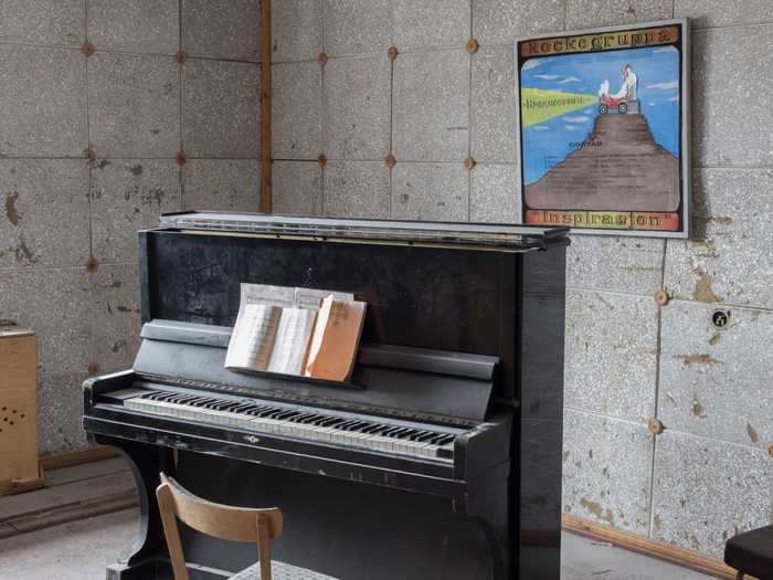 Sheet music lies propped against a piano waiting to be read ...