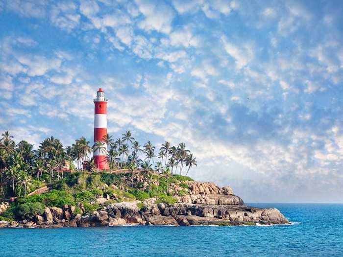 Kovalam Beach Lighthouse in India overlooks long stretches of sandy beaches.
