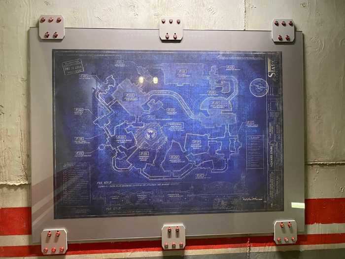 A blueprint of Avengers Campus can be seen in the hallway before you board the attraction.