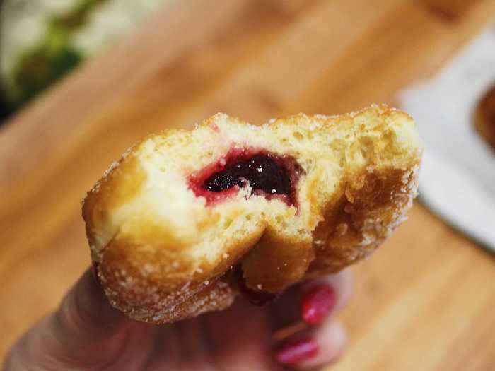 The jelly inside was tart and perfectly complemented the sweet powdered sugar doughnut.