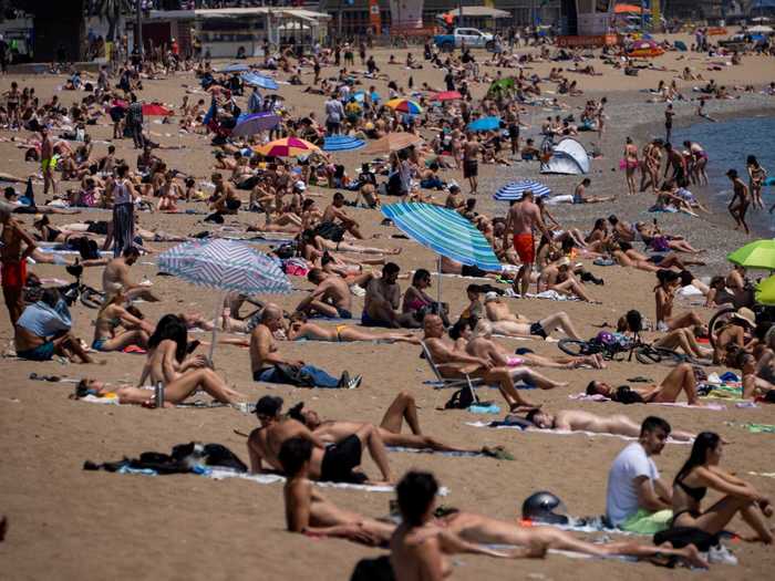 And on Tuesday, people were pictured flocking to beaches in Barcelona.