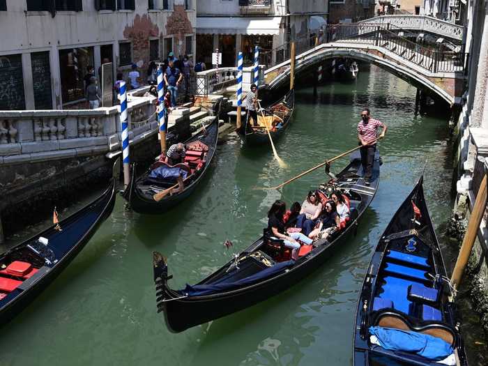 Visitors also took mask-less rides on gondolas through the canals of Venice.