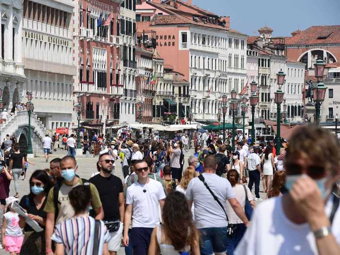 On Saturday, tourists were pictured flooding the streets of Venice near the Ponte della Paglia bridge.