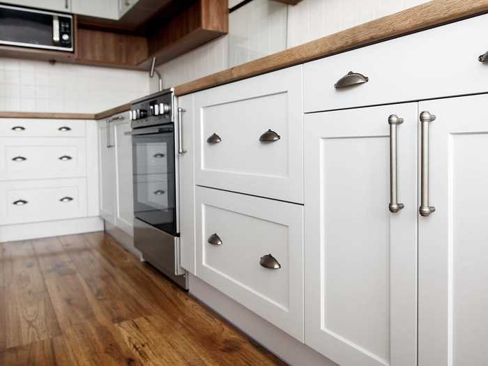 Update your kitchen cabinetry by replacing just a few pieces such as the handles and doors.