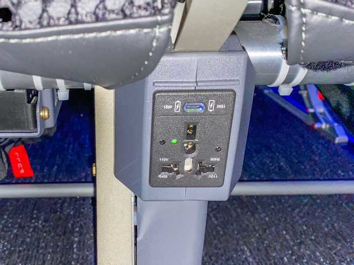 In-flight power is also doubly offered on this aircraft. Passenger-facing 110v AC power outlets are located under the seats and USB charging ports are also found under the screens themselves.