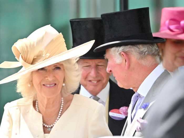 Camilla, Duchess of Cornwall, and Prince Charles attended the races following dress codes of their section, the Royal Enclosure. Men are supposed to wear a full morning suit with a waistcoat and a top hat. Women must wear modest dresses and hats with a minimum diameter of four inches.