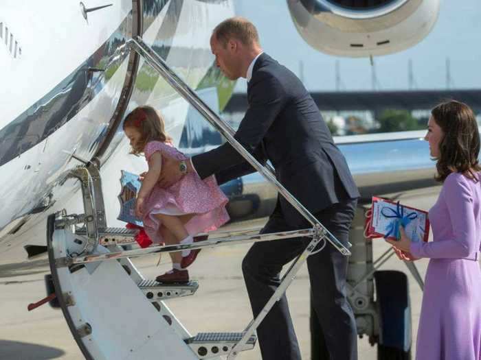 He gave Princess Charlotte a boost as they departed Germany in 2017.