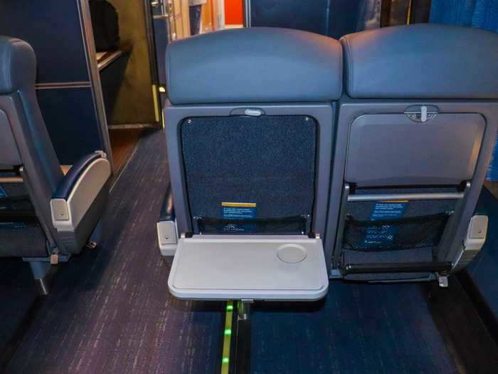 Tray tables remain where riders can eat, drink, or get work done on a laptop using Amtrak