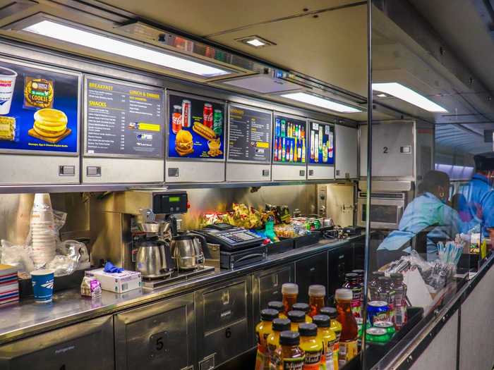 The cafe was open with extra precautions like plexiglass partitions and social distancing floor placards.