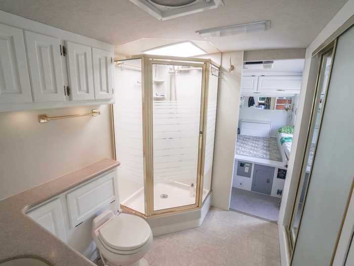 Through the kitchen is the bathroom, which is also the full width of the RV.