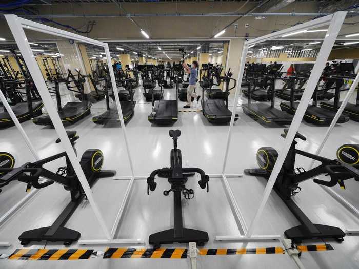 The gym also has plexiglass barriers between the machines.