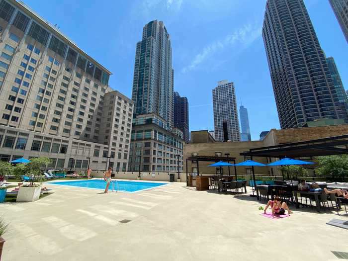 The building has a fitness center, but the most impressive amenity is the beautiful pool.