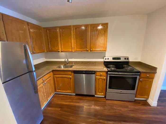 The kitchen is completely updated and has stainless steel appliances.