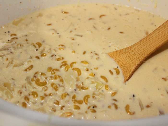 I added in the uncooked macaroni noodles after adding in both kinds of milk, a teaspoon of Dijon mustard, salt, and pepper.