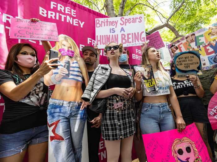 Fans held signs, waved flags, and made speeches demanding the end of the pop star