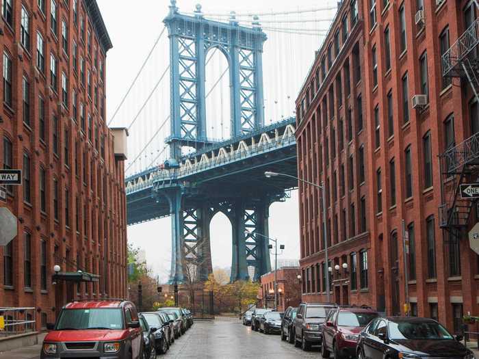 Get the full New York experience while walking on the Brooklyn Bridge.