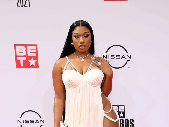 Megan Thee Stallion arrived in a white gown with bold slits on each side.