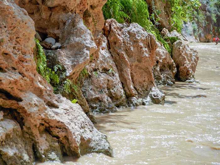 The Narrows is a trail that leads you into the river. The river gets deeper and deeper as you go ...