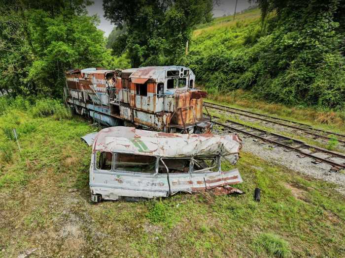 The post-collision bus and train are still located in the Smoky Mountains outside Sylva, North Carolina.