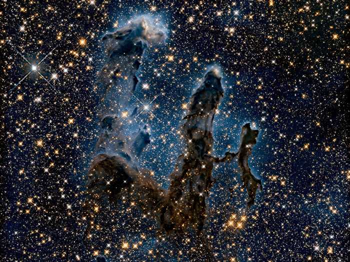 Hubble has even imaged the pillars in near-infrared light - revealing the newborn stars hidden in the dust.