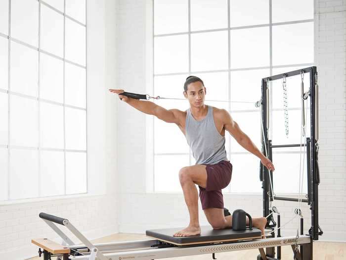 The V2 Max Plus reformer is three machines in one: a raised mat platform, a reformer, and virtual Cadillac. It has six features, including a rope and spring system that allow for including lying down, side-lying, standing, kneeling, and sitting. There are 34 classic Pilates poses that range from yoga-like moves to ab workouts.