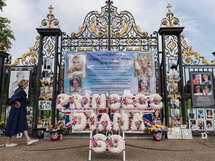 And by mid-afternoon on July 1, dozens of fans had visited the palace, leaving behind a tribute teeming with flowers, pictures, messages, and flags.