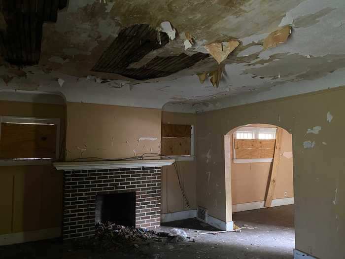 The living room was void of light, but the fireplace caught my attention.