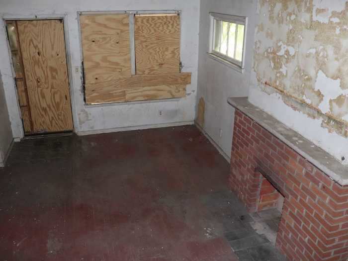 The living room was completely boarded up and dark.