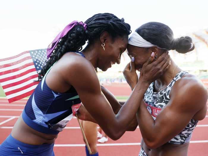 6/20: Quanera Hayes (left) congratulates Keni Harrison after the latter won the 100-meter Hurdles Final to qualify for the Tokyo Olympics.