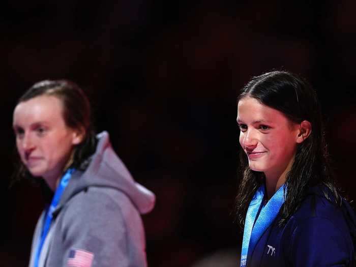 6/19: 15-year-old Katie Grimes (right) stands alongside American swimming superstar Katie Ledecky after she qualified for the Tokyo Olympics in the 800m freestyle.