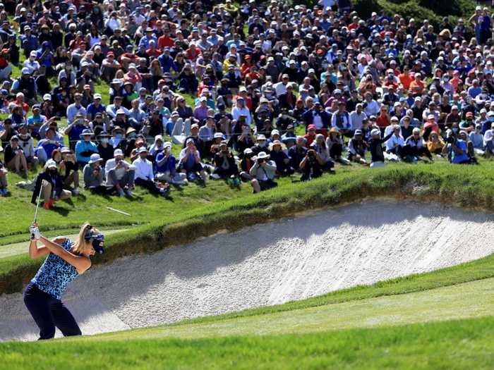 6/6: American golfer Lexi Thompson hits from the bunker on the 18th hole during the final round of the US Women