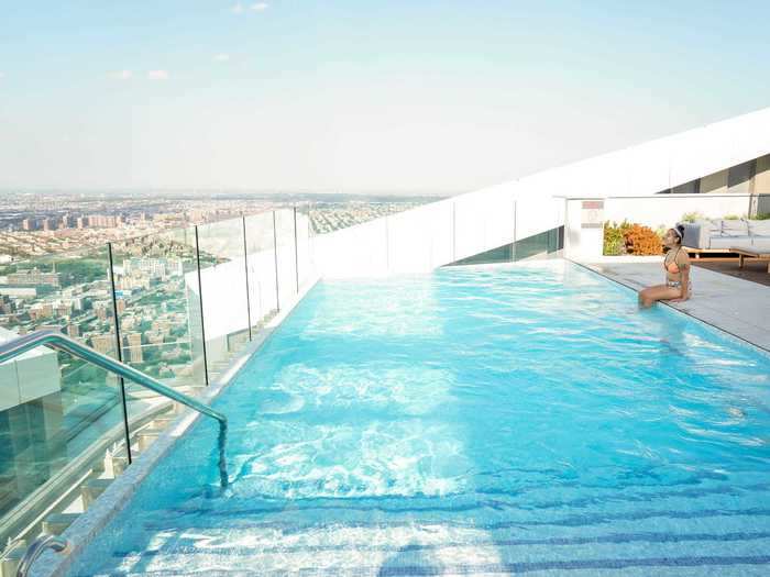 Sitting on the edge of the pool, I pictured myself living in the luxury skyscraper.