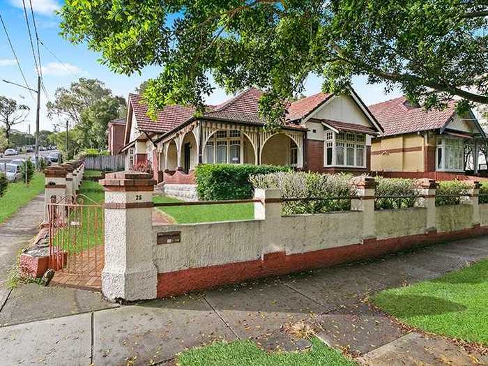 The listing says the property is located on a "quiet street framed by a beautiful tree canopy" and has off-street parking space for up to three cars.