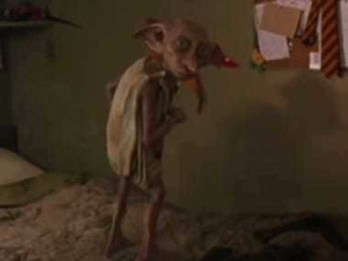 Dobby first speaks when he greets Harry.