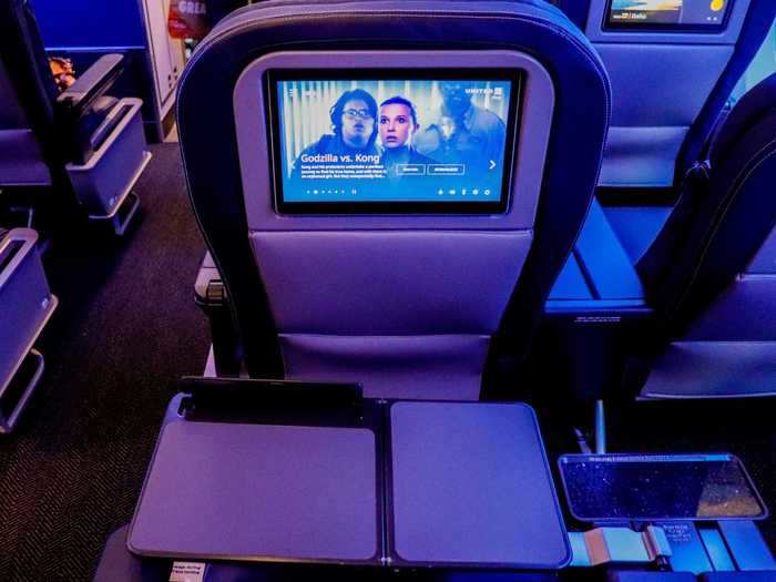 Despite the new screens, tray tables will still include device holders for those that prefer to use a mobile device for entertainment.