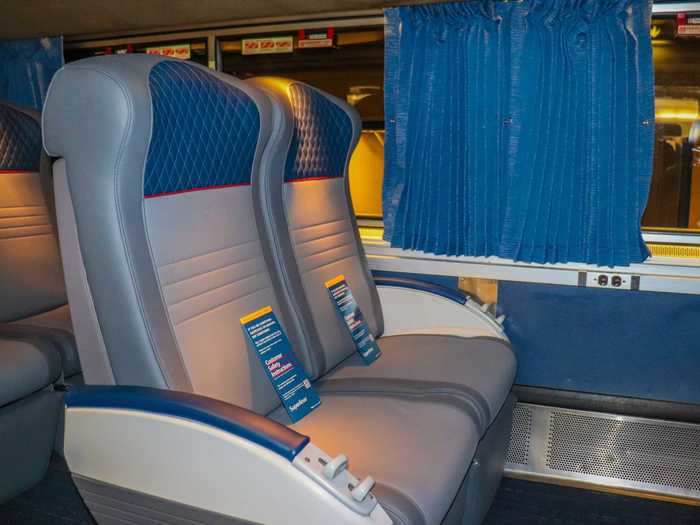 The tired blue cloth seats of Amtrak